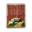 Plate of traditional Mici Mititei boieresti from Marcel, grilled and served on a white dish with garnishes.